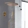 A modern bathroom shower system with a rainfall showerhead and handheld sprayer, set against a gray tiled wall and a white partition. Náhled obrázku produktu