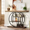 A console table with decorative items and artwork displayed on and above it, placed in a hallway or entryway. Voir les images du produit