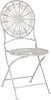 A white metal bistro chair with an ornate, sunburst-like backrest and seat, shown from a front-side angle against a white background. Produktbild-Vorschau