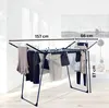 A drying rack with clothes hanging on it, with dimensions indicated by text overlays. Produktbild-Vorschau