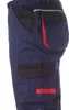 A close-up side view of navy blue work pants with black and red accents. Produktbild-Vorschau