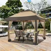 A gazebo set up on a wooden deck with a table and chairs underneath. Produktbild-Vorschau
