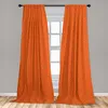 Two orange curtains with an abstract pattern hang in front of a window. Produktbild-Vorschau