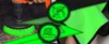 A close-up shot of a drill with a brush attachment, and a hand holding a green microfiber cloth. Two green circular icons with line drawings are overlaid on the image. Podgląd zdjęcia produktu