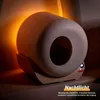 A self-cleaning cat litter box with an orange night light illuminating its side. Produktbild-Vorschau