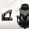 A gaming chair with a close-up inset showing a detail of the armrest. Náhled obrázku produktu