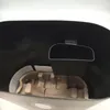 Interior view of a black shredder with a brown paper insert. Produktbild-Vorschau