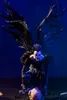 A collectible figure of Ryuk from Death Note, sitting on a skull. Voir les images du produit