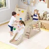 Children playing on a wooden indoor climbing structure with a slide and climbing wall. Produktbild-Vorschau