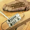 A meat branding iron with interchangeable letters is shown next to a piece of meat that has been branded with the words "MEAT IS MURDER". Náhľad obrázku produktu