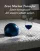 A bowling ball and a glass of red wine are placed on a mattress. Produktbild-Vorschau