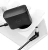 A black power adapter plugged into a white charging station. Anteprima dell’immagine prodotto