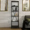 A tall, anthracite bookshelf filled with books and decorative items, placed in a well-decorated room with artwork on the wall and a sofa nearby. Podgląd zdjęcia produktu