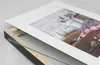 A close-up, angled view of a picture frame with a mat and a photograph inside, resting on a white surface. Produktbild-Vorschau