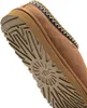 Close-up view of the sole and side of a brown UGG slipper. Voir les images du produit