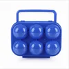 A blue plastic egg carton with a handle, designed to hold six eggs. Produktbild-Vorschau