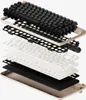 An exploded view of a mechanical keyboard, showing its internal layers. Produktbild-Vorschau