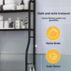A black shelf unit with various bathroom products on display, next to a tiled wall. Produktbild-Vorschau