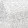 A close-up, angled view of a light gray carpet with a textured, ribbed pattern. Anteprima dell’immagine prodotto