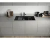 A modern kitchen sink with a black faucet and accessories on a gray countertop. Podgląd zdjęcia produktu