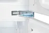 Close-up of a refrigerator hinge mechanism, showing a metal bracket attached to the interior wall of the appliance. Produktbild-Vorschau