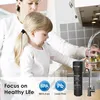 A woman and a child are in a kitchen, with the child looking at a water filter attached to a faucet. Produktbild-Vorschau