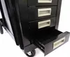 A close-up view of a black metal tool cart with four drawers, one of which is partially open. Produktbild-Vorschau