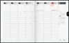 An open planner showing a weekly layout with dates and time slots. Produktbild-Vorschau