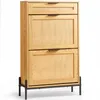 A wooden shoe cabinet with rattan inserts and black metal legs, shown against a white background. Podgląd zdjęcia produktu