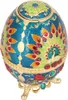 A decorative, egg-shaped trinket box with a peacock design, resting on a stand. Produktbild-Vorschau