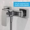 A close-up of a chrome shower faucet mounted on a tiled wall. Produktbild-Vorschau