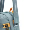 Close-up of a blue crossbody bag with orange zipper pulls and a gray strap. Voir les images du produit