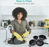 A woman is washing pots and pans in a kitchen sink, with a set of pots and pans displayed in the foreground. Náhled obrázku produktu