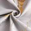A close-up view of a gray fabric with a gold marbled pattern, folded and creased. Produktbild-Vorschau