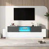 A modern TV stand with a television mounted above it, in a well-lit room. Náhľad obrázku produktu