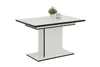 A modern dining table with a white surface and black accents, set against a white background. A small potted plant and a glass object are placed on top. Produktbild-Vorschau