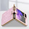 A pink glittery phone case with a gold ring holder is displayed open, showing the phone screen inside. Produktbild-Vorschau
