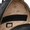 Close-up view of the interior of a GUESS backpack, showing the lining with repeating logos and a zippered pocket. Produktbild-Vorschau