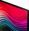 A close-up view of a television screen displaying a colorful, abstract wavy pattern. Voir les images du produit