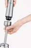 A person is holding two parts of a hand blender, demonstrating how to connect them. Produktbild-Vorschau