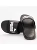 A pair of black Puma slide sandals shown from a side angle against a white background. Anteprima dell’immagine prodotto