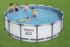People enjoying a Bestway Steel Pro MAX above-ground swimming pool on a grassy lawn. Produktbild-Vorschau