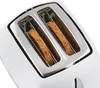 Close-up of a white toaster with two slices of multi-grain bread inside. Podgląd zdjęcia produktu