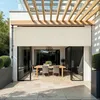 An outdoor patio with a dining set and a retractable awning. Náhled obrázku produktu