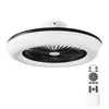 A white ceiling fan with a black trim and fan blades, shown from a slightly angled top-down view. A remote control is positioned to the right of the fan. Náhled obrázku produktu