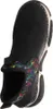 A top-down view of a black slip-on shoe with a colorful patterned trim. Voir les images du produit