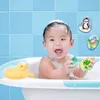A baby is taking a bath with toys. Produktbild-Vorschau