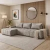A modern living room with a sectional sofa, a floor lamp, and wall art. Produktbild-Vorschau