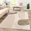 A modern living room with a sofa, rug, and bench. Produktbild-Vorschau