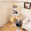 A multi-level cat tree with two cats, placed in a room with a couch and a painting on the wall. Anteprima dell’immagine prodotto